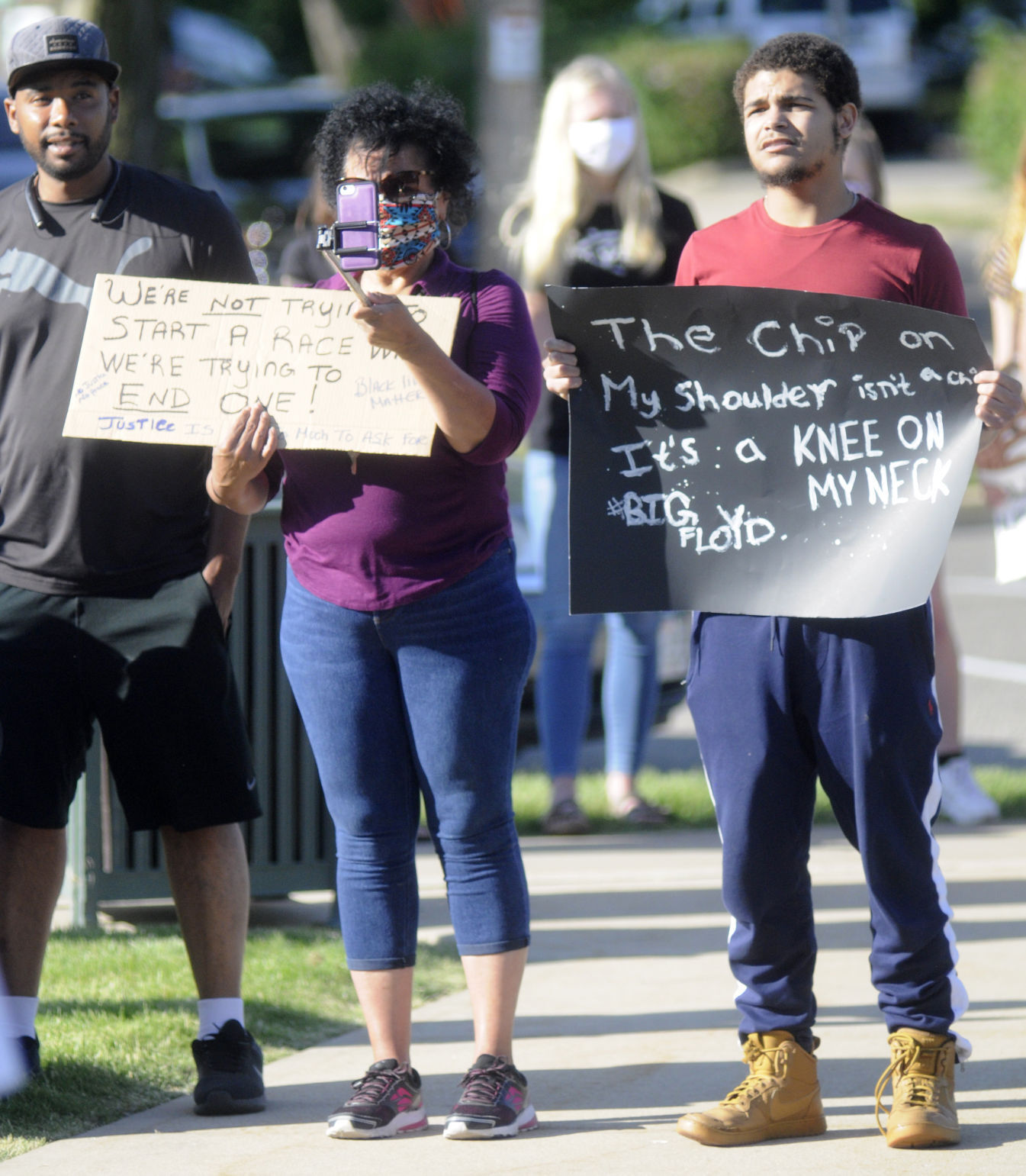 Protesters holds signs in Lake Geneva